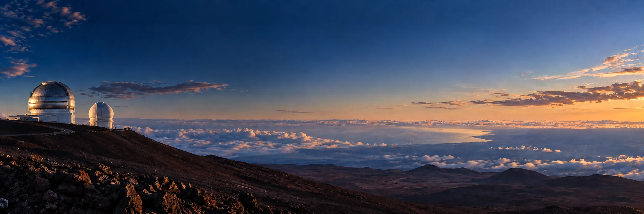 Photo-informed composite of Gemini and CFHT on Mauna Kea at twilight